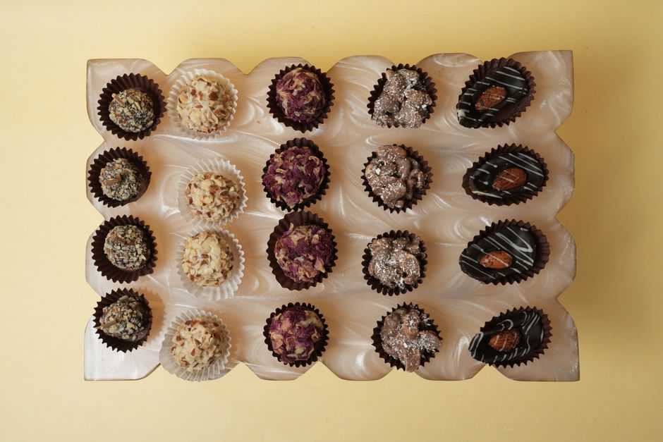 A ribboned box of chocolates arranged for a gift